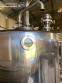 Llenadora rotativa gravim�trica de acero inoxidable con cabina