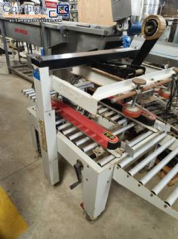 Maquina selladora de cajas de cart�n Strapack