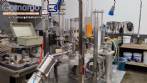 M�quina rotativa de llenado y dosificaci�n con unidad de taponado y sellado para vasos y botellas, con capacidad para 2.000 unidades.